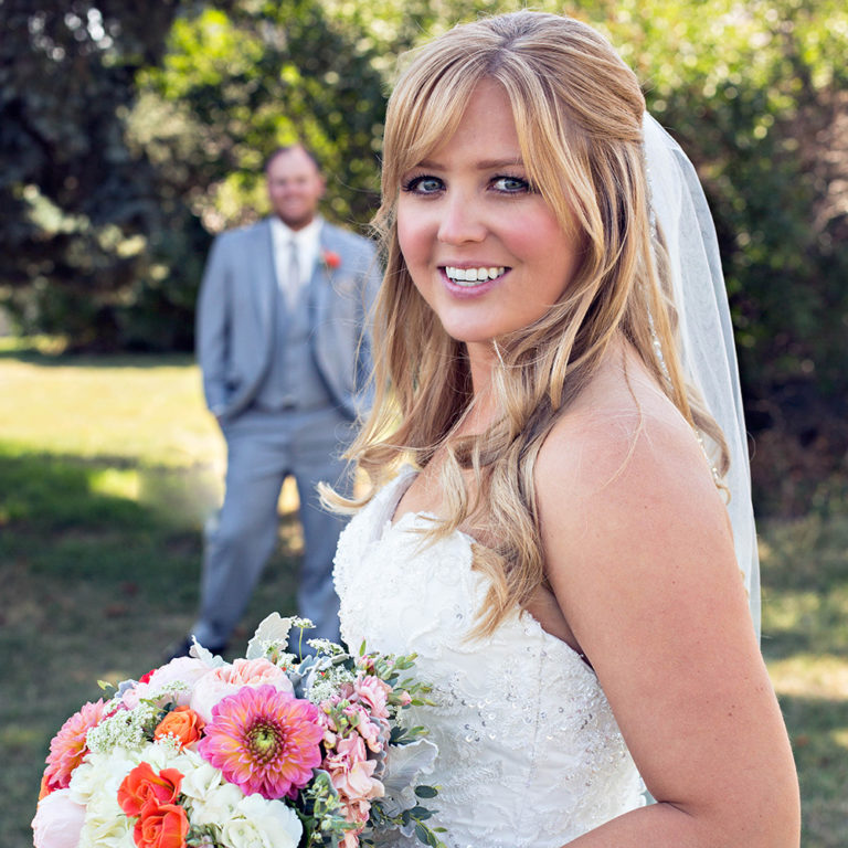 wedding photography of a flower girl smiling