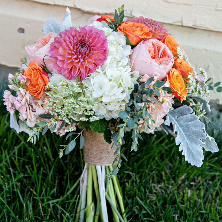 wedding photography of a flower girl smiling