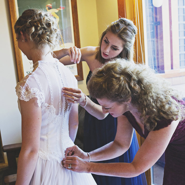 wedding photography of a flower girl smiling