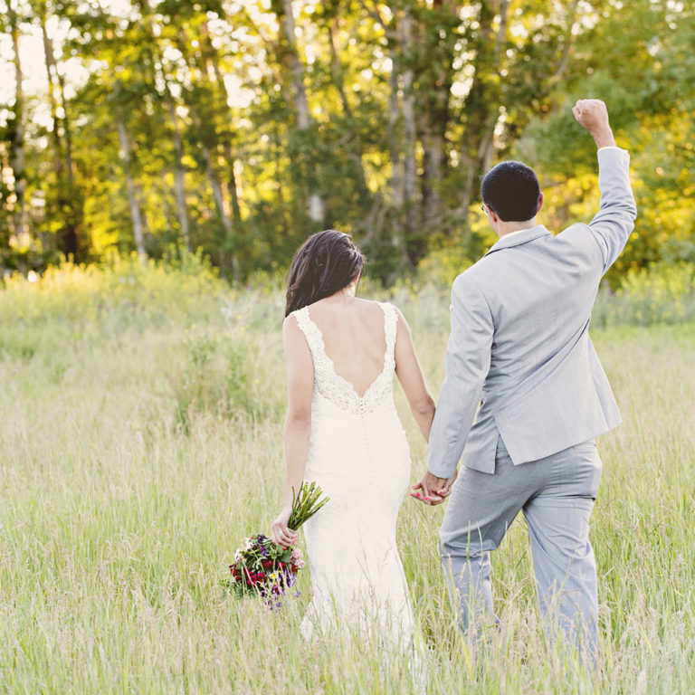 wedding photography of a flower girl smiling