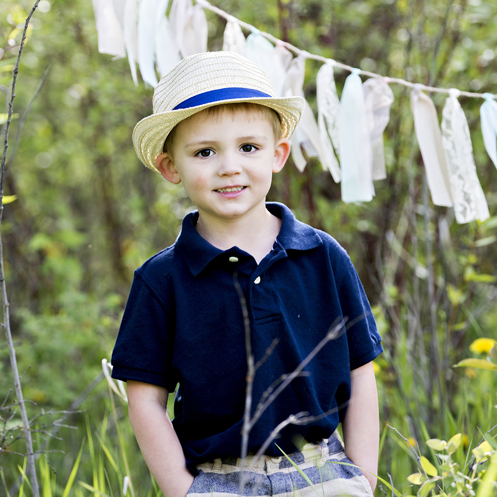 holiday portrait photography of two toddler brothers outside dressed for the holidays