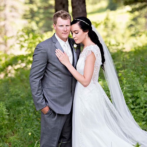 wedding photography of a bride and groom embracing outside after the ceremony