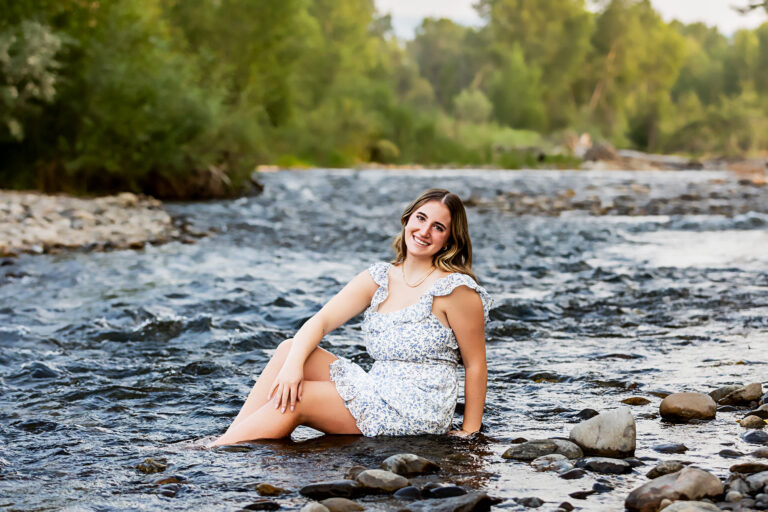 newborn photography of a newborn baby curled up sleeping on a white blanket