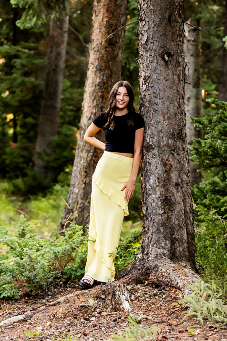 newborn photography of a newborn baby curled up sleeping on a white blanket